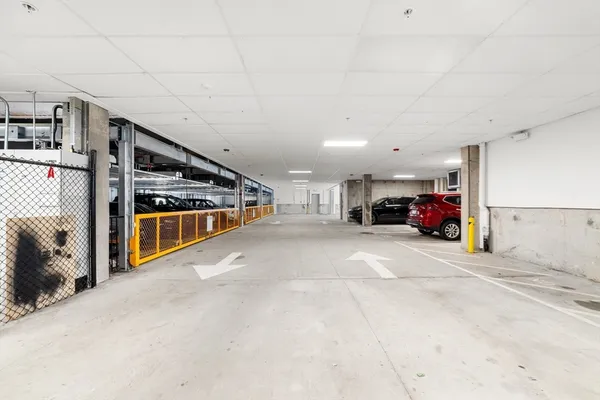 a view of parking garage with car parked