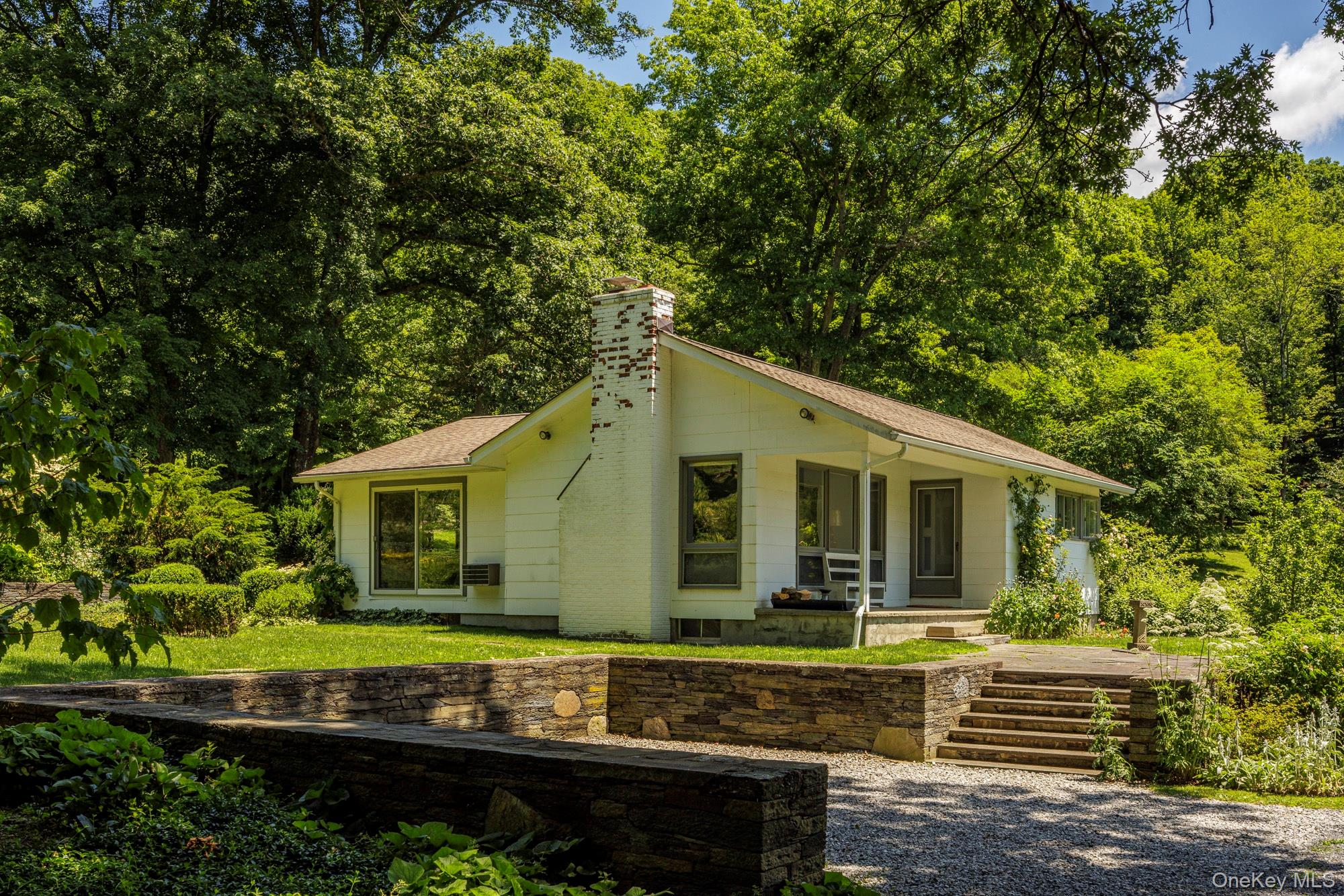 447 Butts Hollow Road Dover Plains, NY 12522 - Photo 11 of 27 a view of a house with a yard