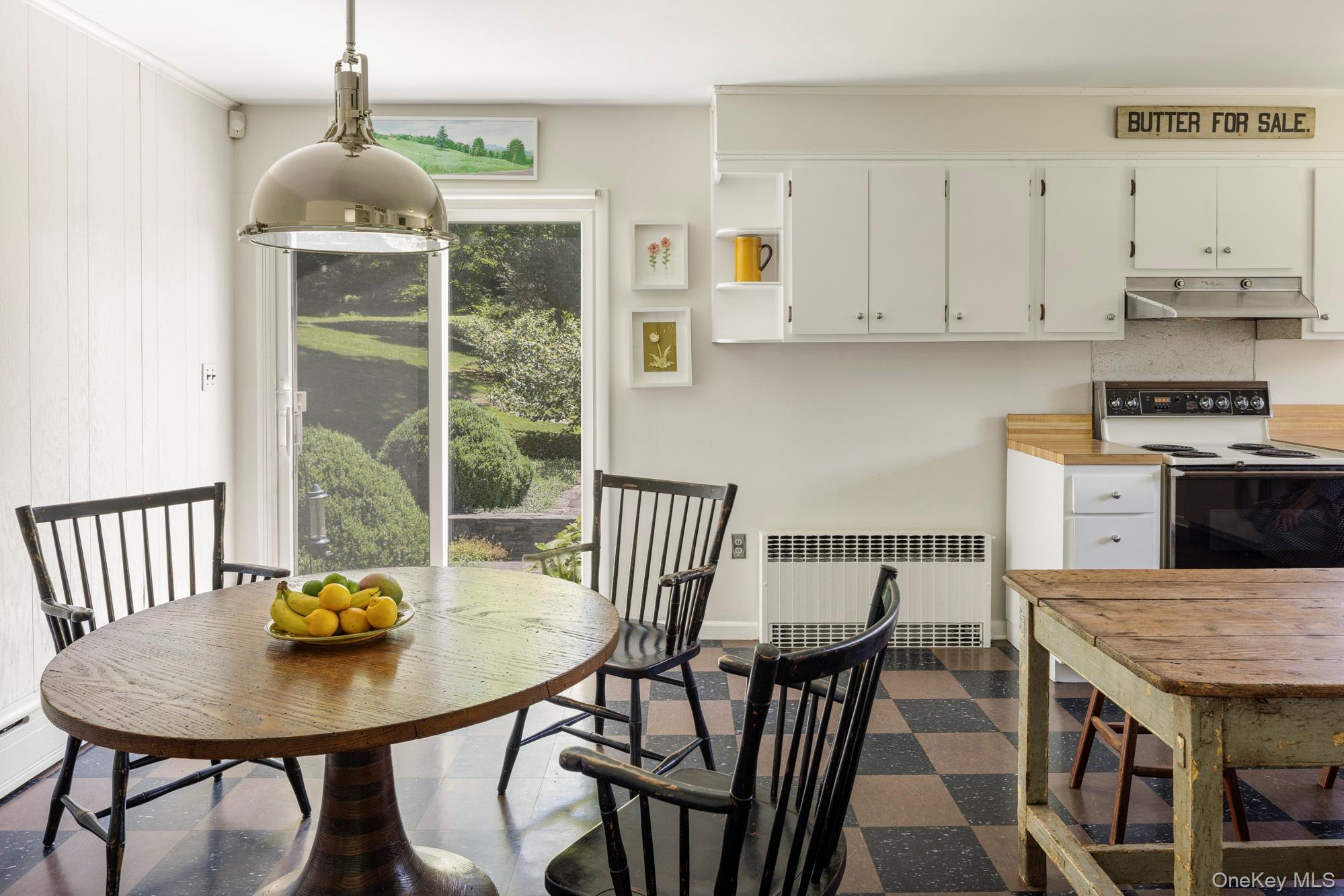 447 Butts Hollow Road Dover Plains, NY 12522 - Photo 22 of 27 a kitchen with stainless steel appliances granite countertop a dining table chairs and a stove