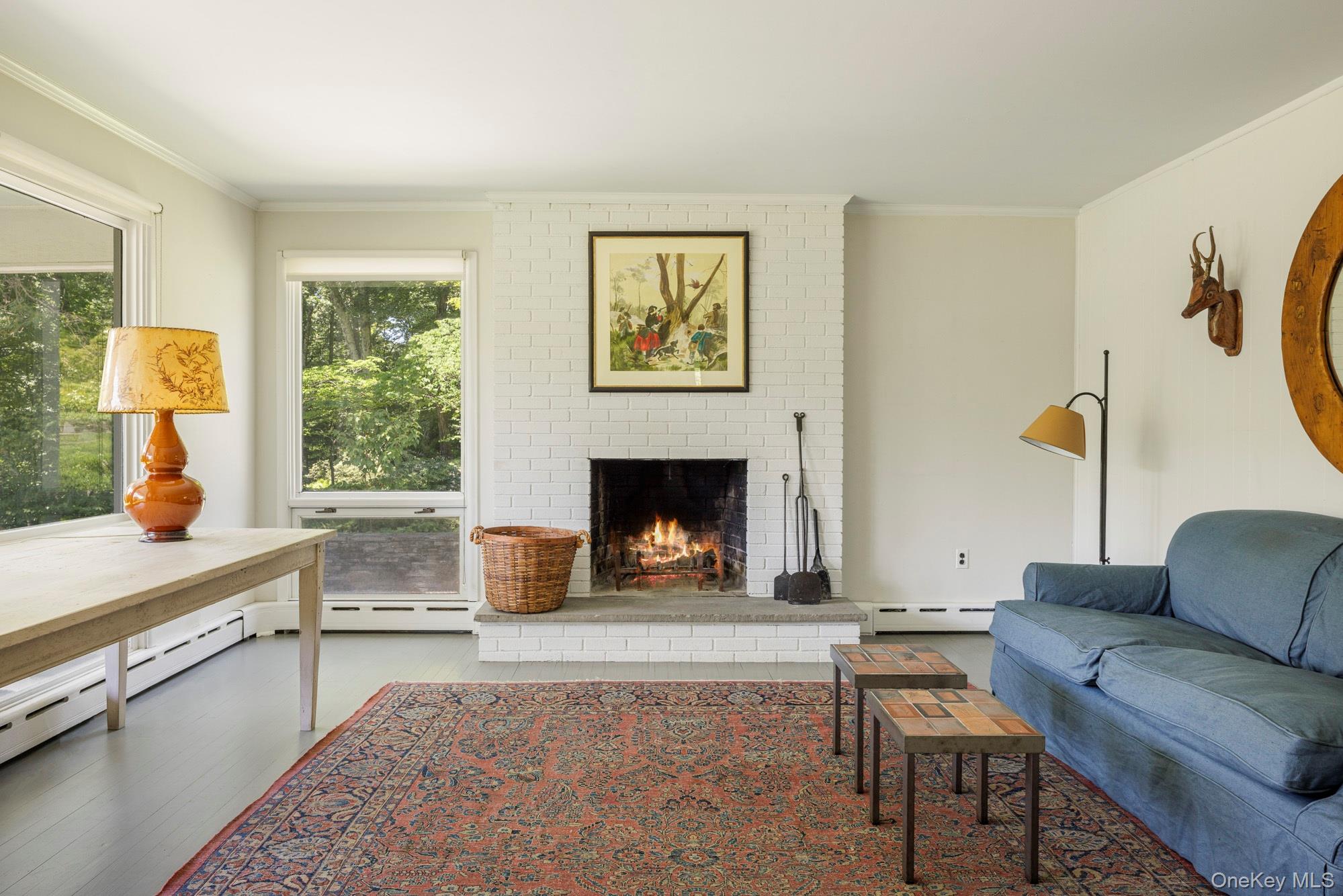447 Butts Hollow Road Dover Plains, NY 12522 - Photo 23 of 27 a living room with furniture a window and a fireplace