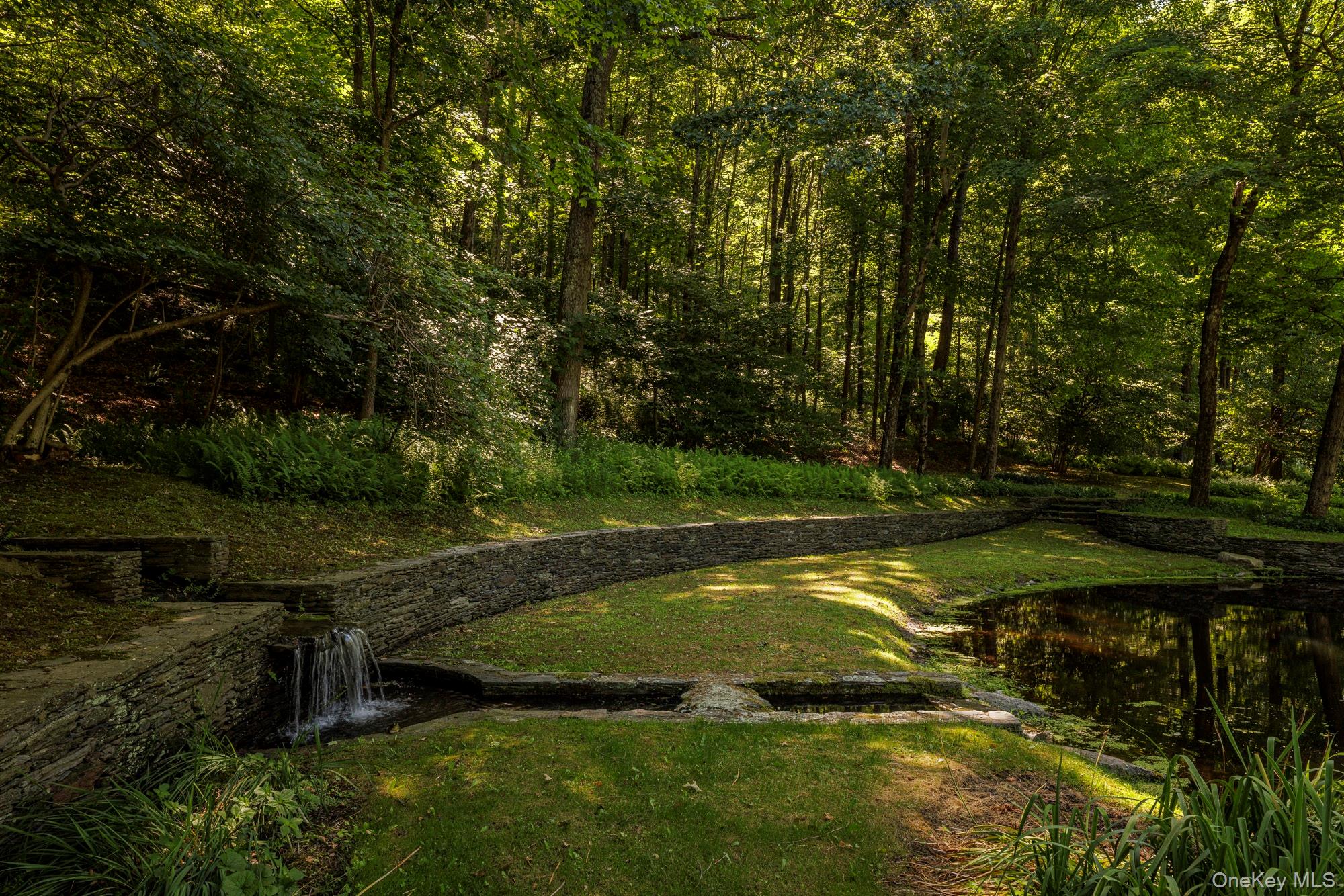 447 Butts Hollow Road Dover Plains, NY 12522 - Photo 7 of 27 a view of a backyard with large trees