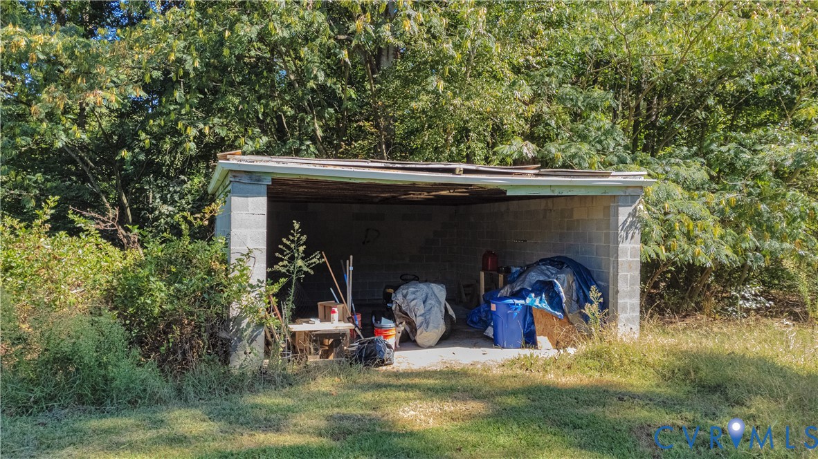 16255 Gun Barrel Road Montpelier, VA 23192 - Photo 40 of 47 View of outbuilding with a carport and a forest vi
