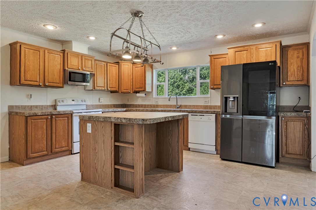 16255 Gun Barrel Road Montpelier, VA 23192 - Photo 9 of 47 Kitchen with white appliances, a center island, a