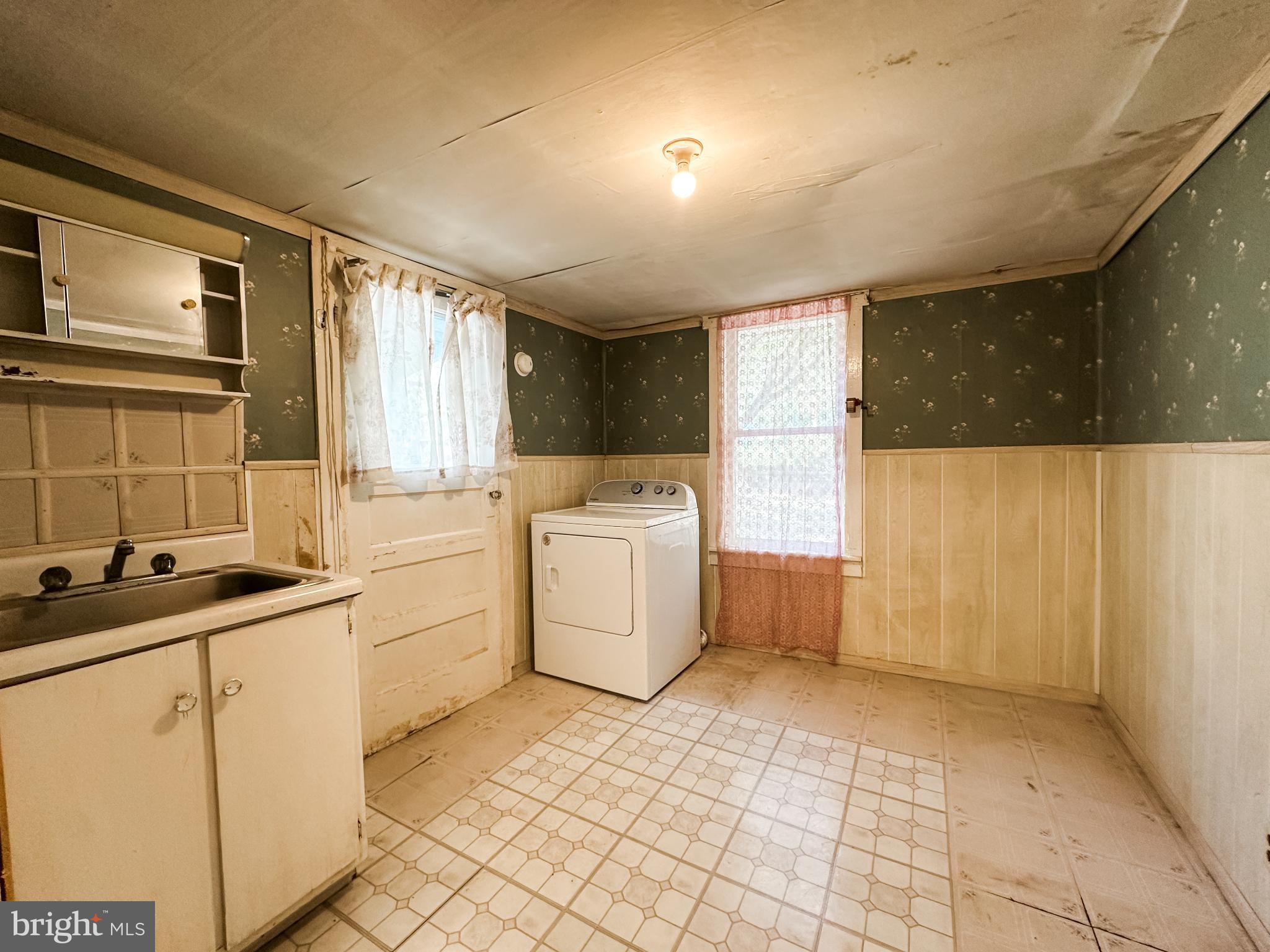 13204 Barrelville Road Northwest Mount Savage, MD 21545 - Photo 15 of 35 a utility room with cabinets washer and dryer