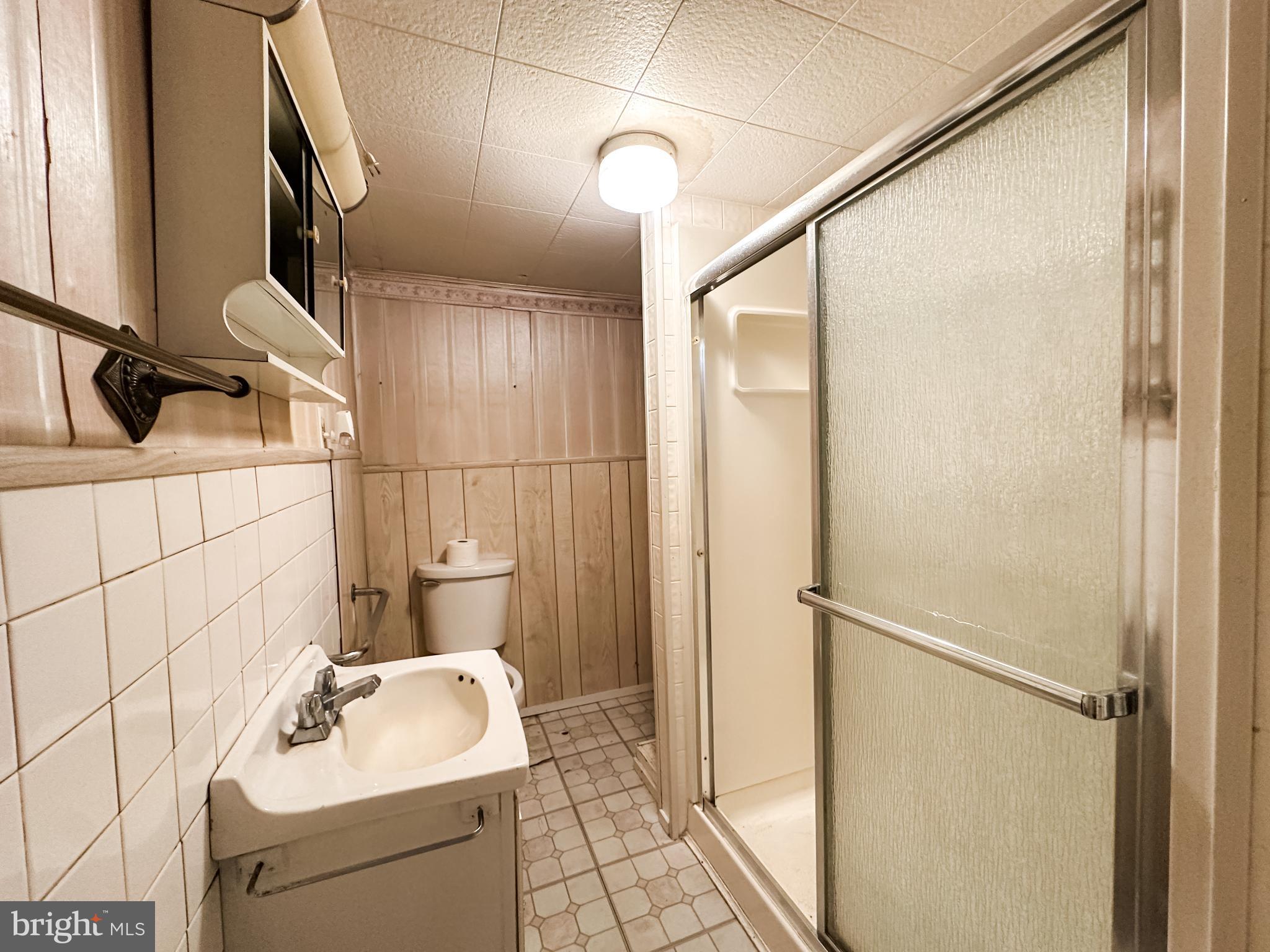 13204 Barrelville Road Northwest Mount Savage, MD 21545 - Photo 16 of 35 a bathroom with a sink toilet and shower