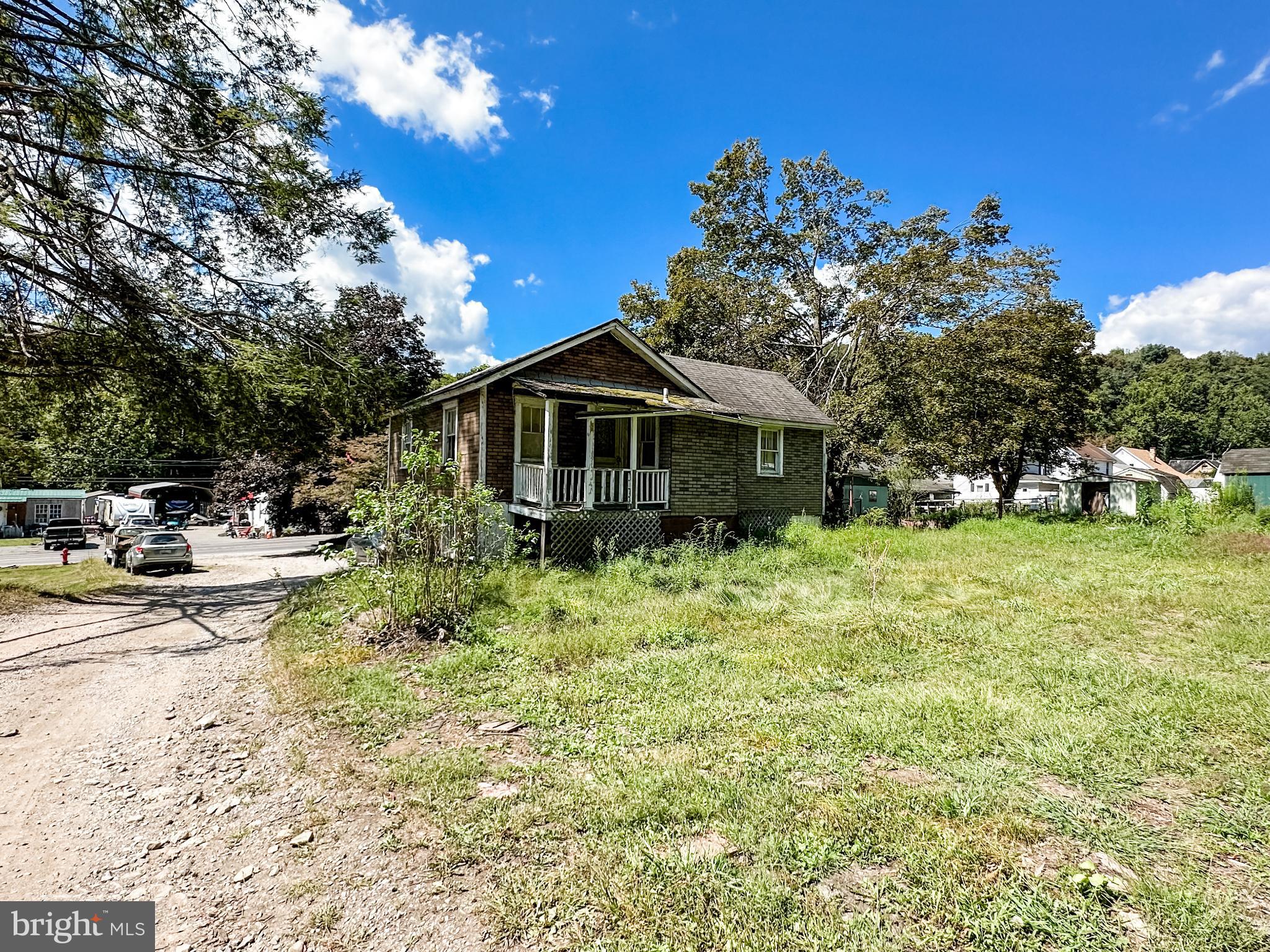 13204 Barrelville Road Northwest Mount Savage, MD 21545 - Photo 29 of 35 a front view of a house with garden