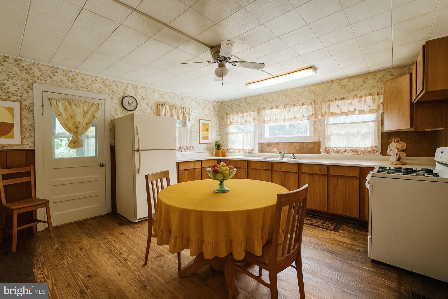 13204 Barrelville Road Northwest Mount Savage, MD 21545 - Photo 6 of 35 a dining room with a table chairs and a kitchen view