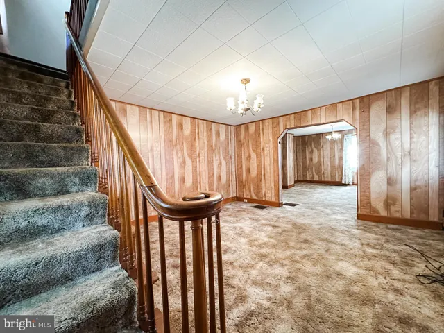 a view of an empty room with stairs