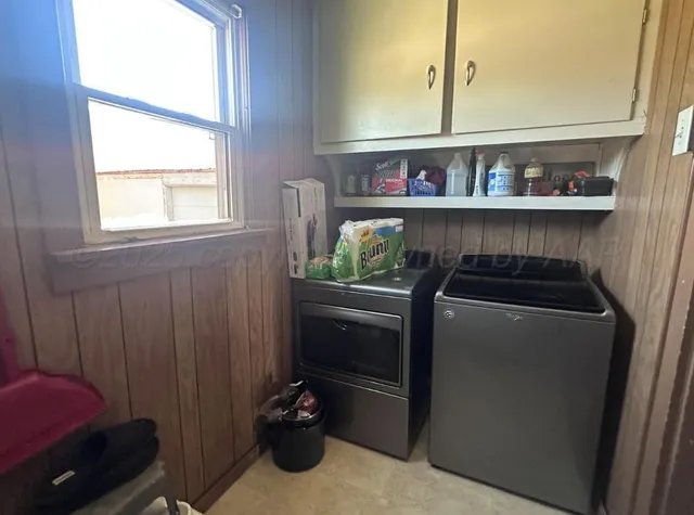 a view of a house with a balcony and garage