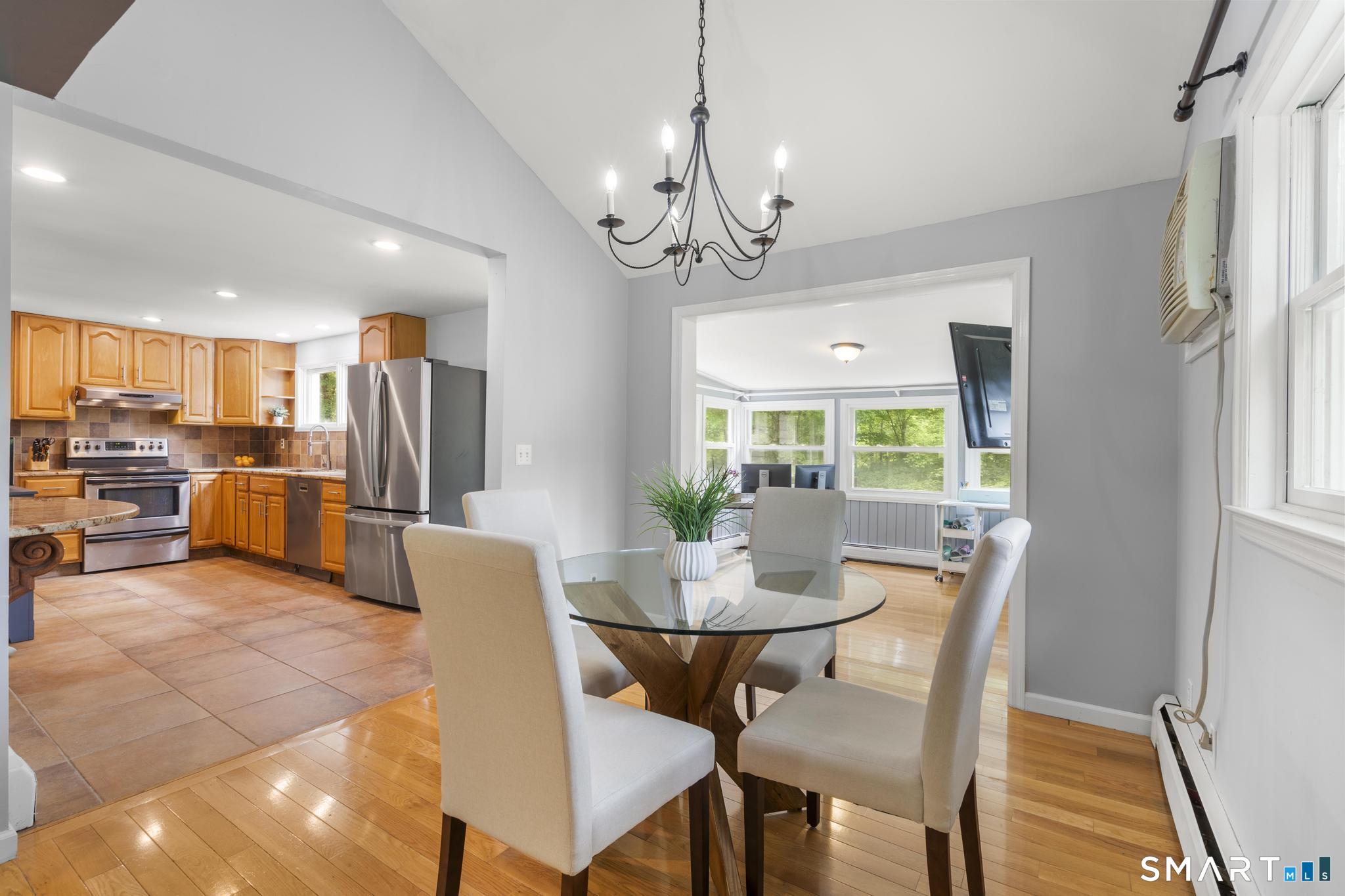 200 Old Huckleberry Road Wilton, CT 06897 - Photo 7 of 24 a view of a dining room with furniture window and outside view