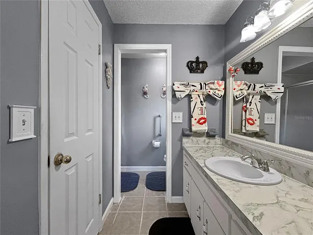 a bathroom with a double vanity sink and mirror