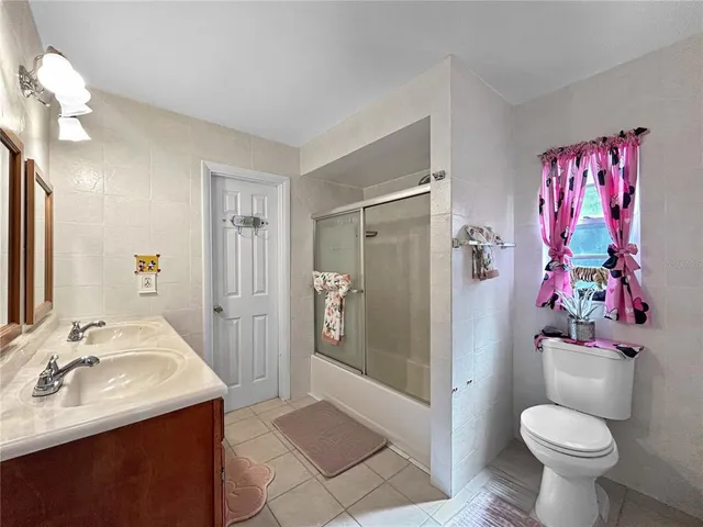 a view of a workspace with furniture and wooden floor