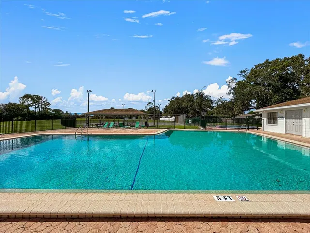 a view of swimming pool with a yard