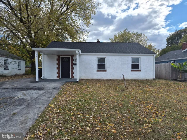 a house with trees in the background