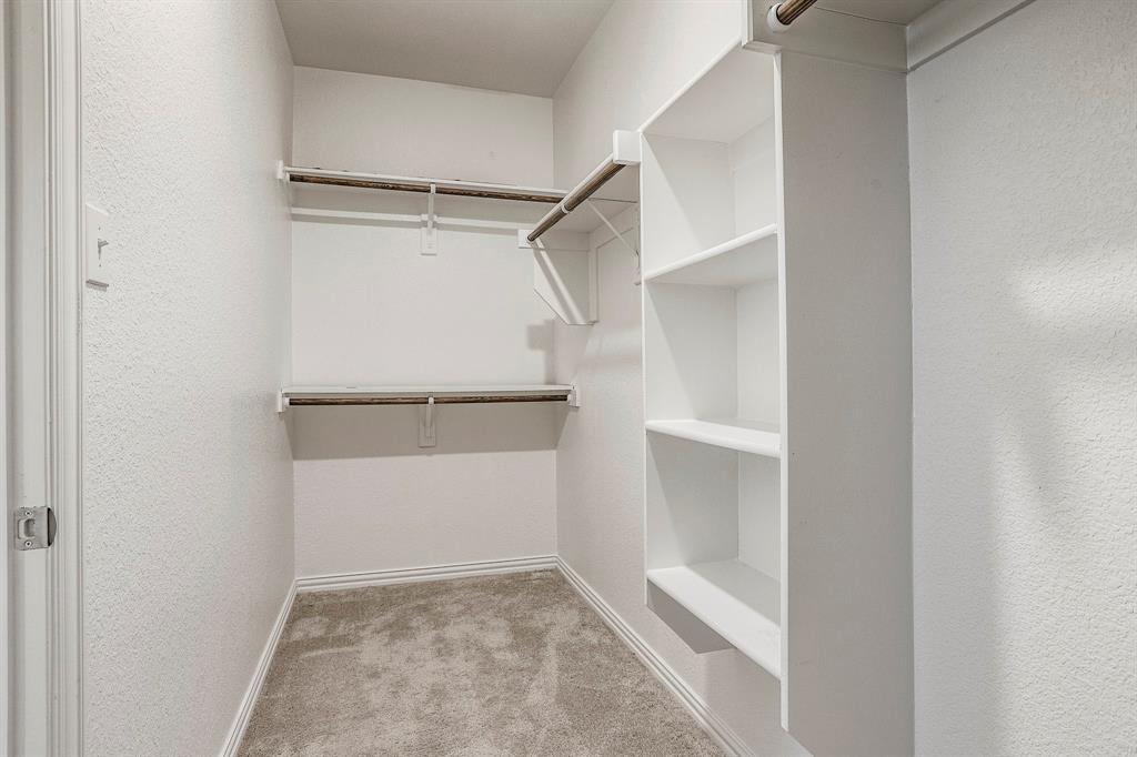 652 Ridgeback Trail Fort Worth, TX 76052 - Photo 17 of 20 Walk in closet featuring light colored carpet