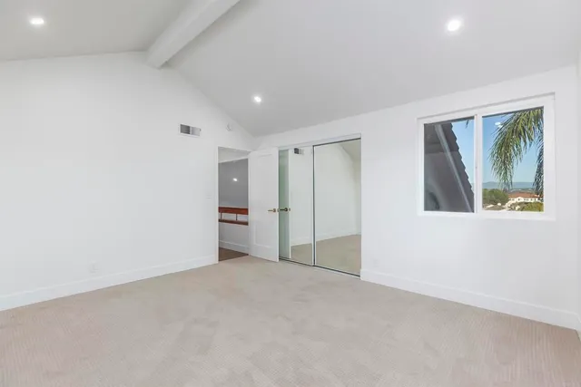 a white bath tub sitting next to a white toilet