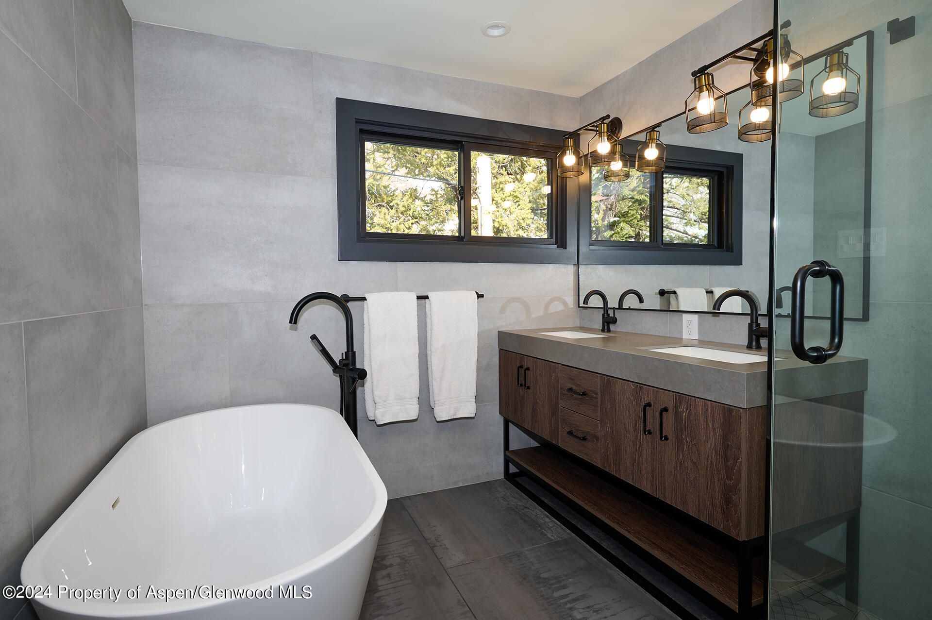1501 Maroon Creek Road, Unit 6 Aspen, CO 81611 - Photo 14 of 48 a bathroom with a double vanity sink a mirror and a bathtub