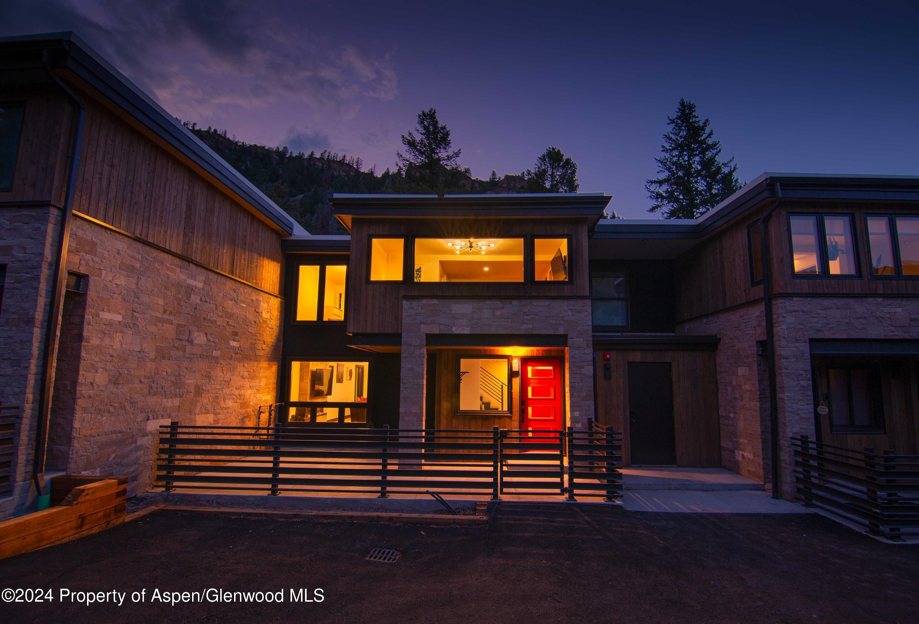 1501 Maroon Creek Road, Unit 6 Aspen, CO 81611 - Photo 18 of 48 a view of outdoor living space with furniture and a fireplace