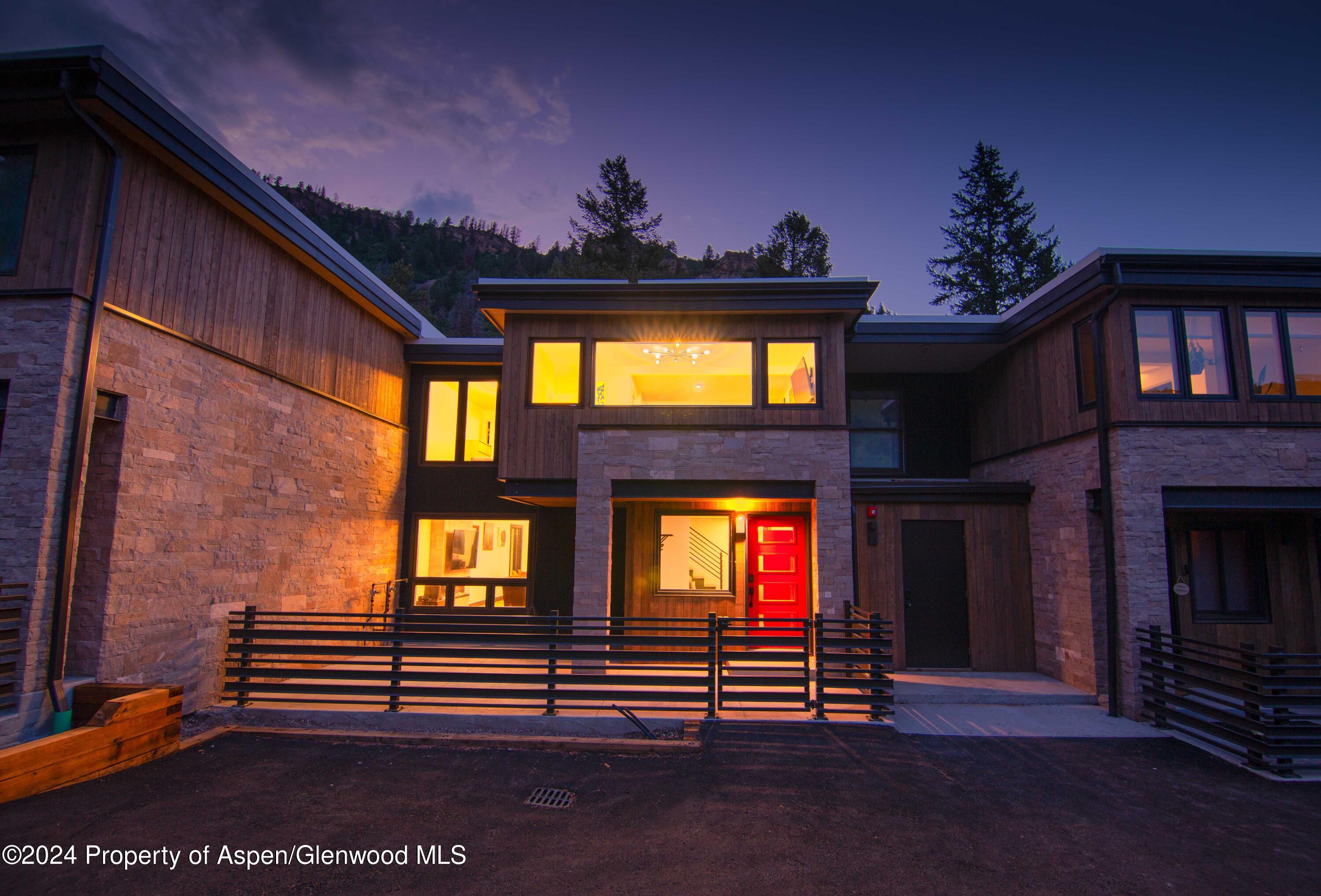 1501 Maroon Creek Road, Unit 6 Aspen, CO 81611 - Photo 20 of 48 a view of outdoor living space with furniture and a fireplace
