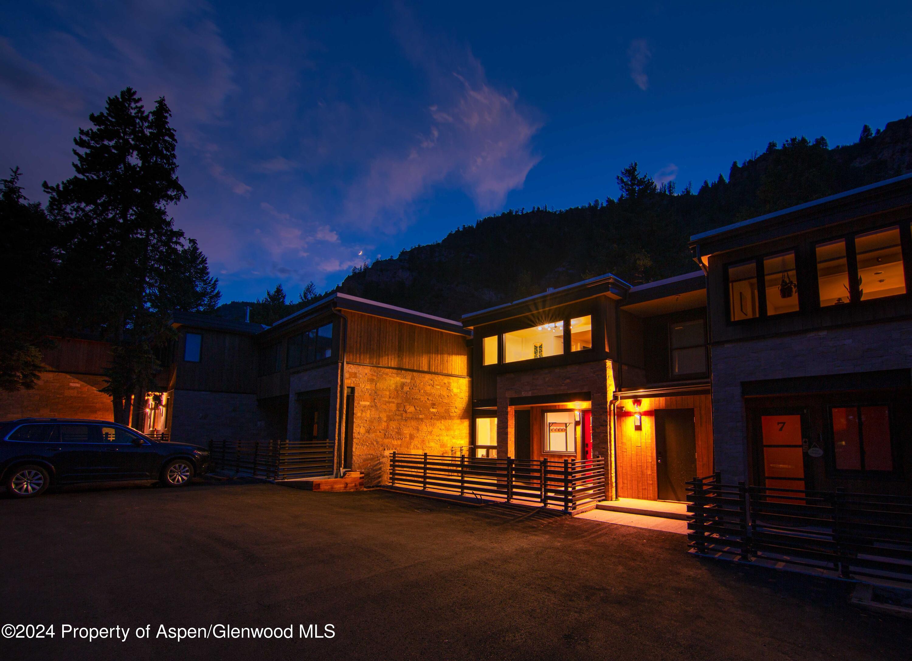 1501 Maroon Creek Road, Unit 6 Aspen, CO 81611 - Photo 24 of 48 a view of building with a street