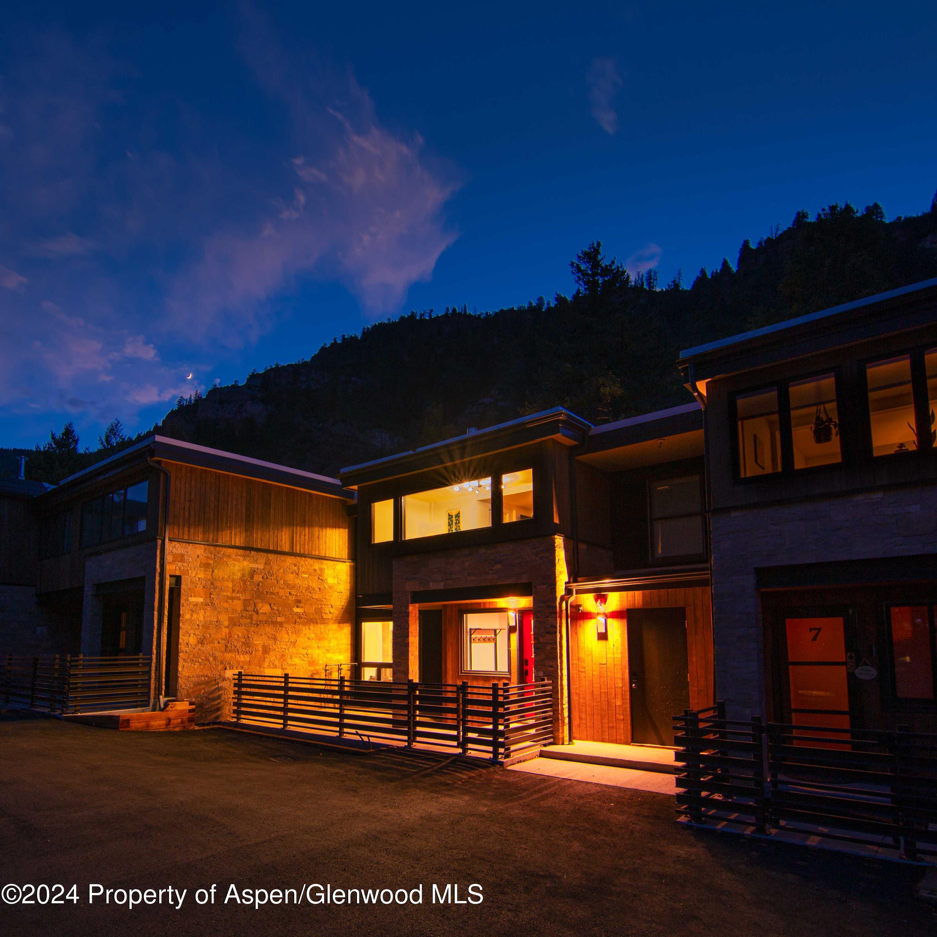 1501 Maroon Creek Road, Unit 6 Aspen, CO 81611 - Photo 25 of 48 a view of building with a flat screen tv