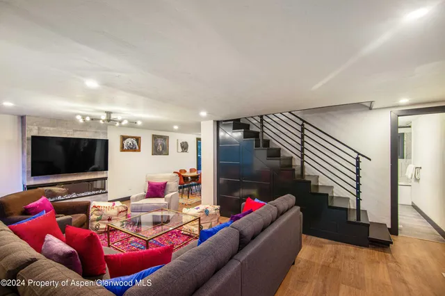 a living room with furniture and a flat screen tv