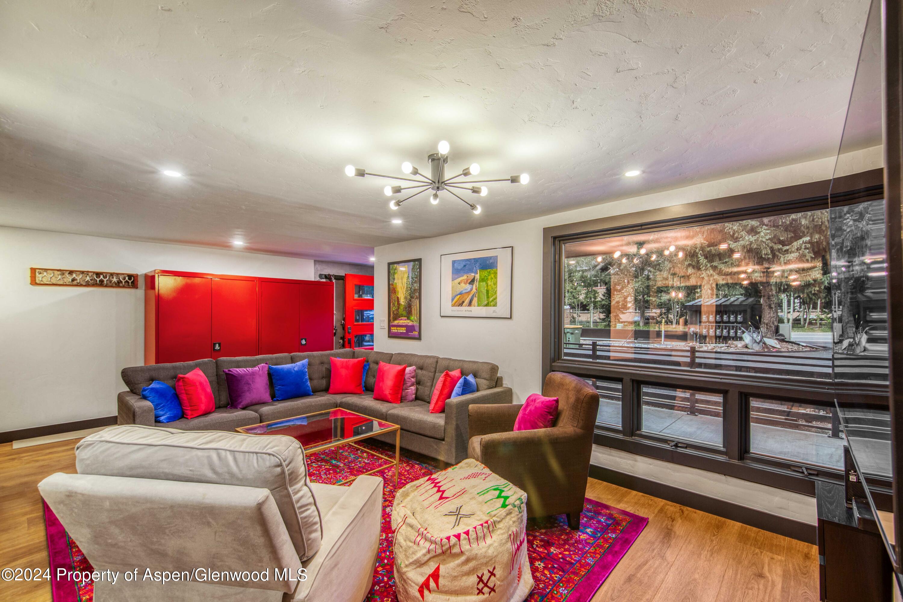 1501 Maroon Creek Road, Unit 6 Aspen, CO 81611 - Photo 30 of 48 a bedroom with furniture and a large window