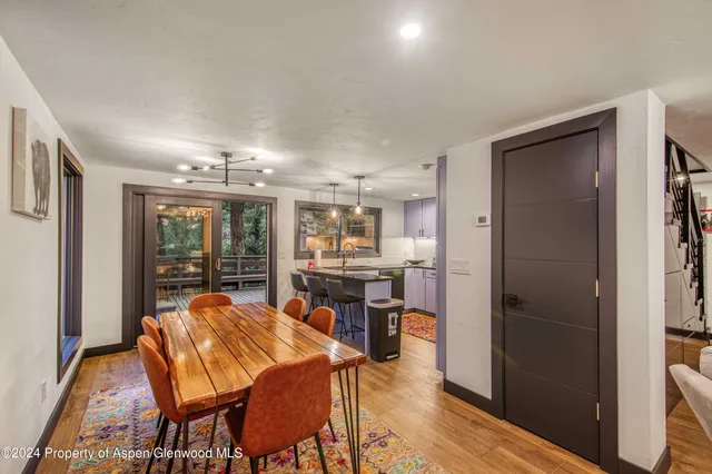 a view of a dining room with furniture and window