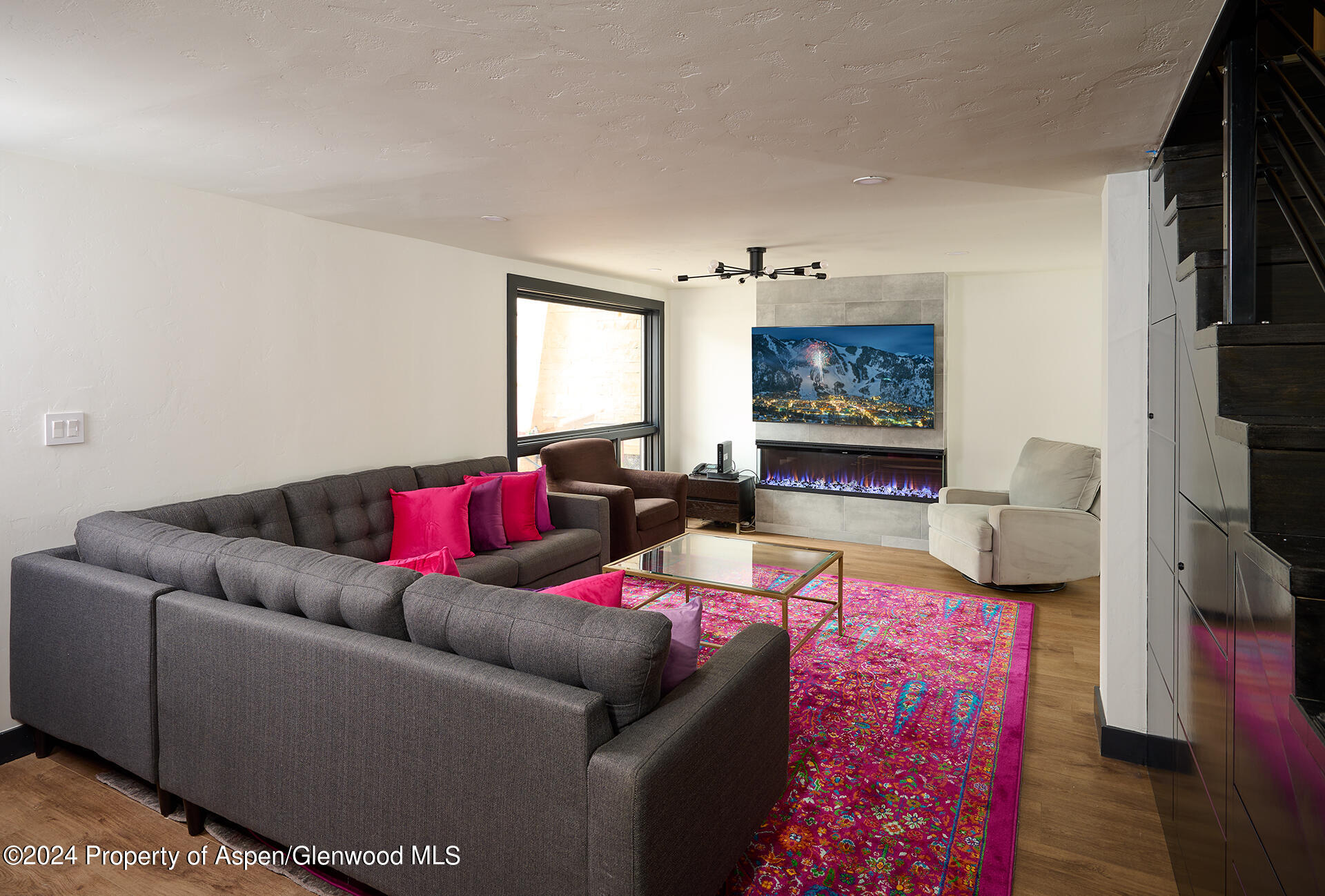 1501 Maroon Creek Road, Unit 6 Aspen, CO 81611 - Photo 5 of 48 a living room with furniture and a couch