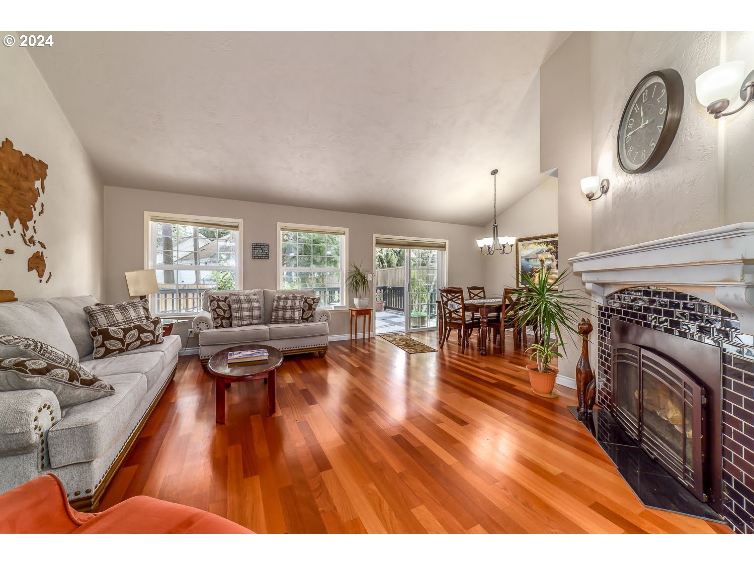 839 South 68th Street Springfield, OR 97478 - Photo 8 of 34 a living room with furniture a rug a fireplace and a large window