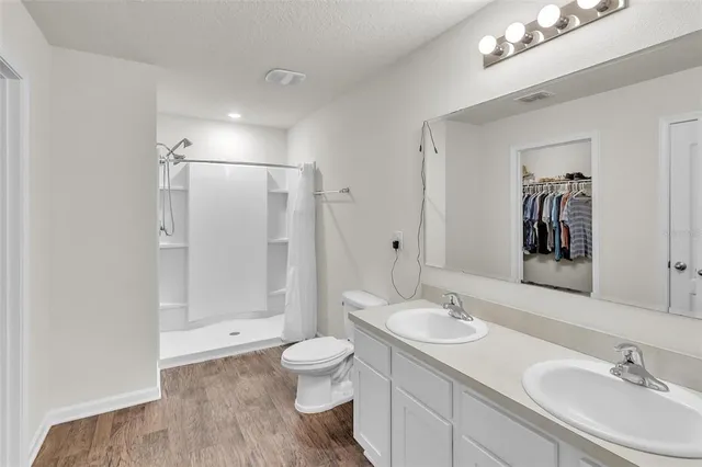 an aerial view of a house with outdoor space