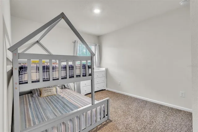 a view of a patio with couches table and chairs and potted plants
