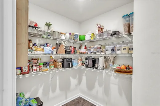 a bed room with a bed and a ceiling fan