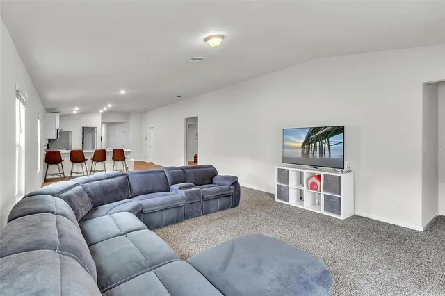 a view of walk in closet with clothes