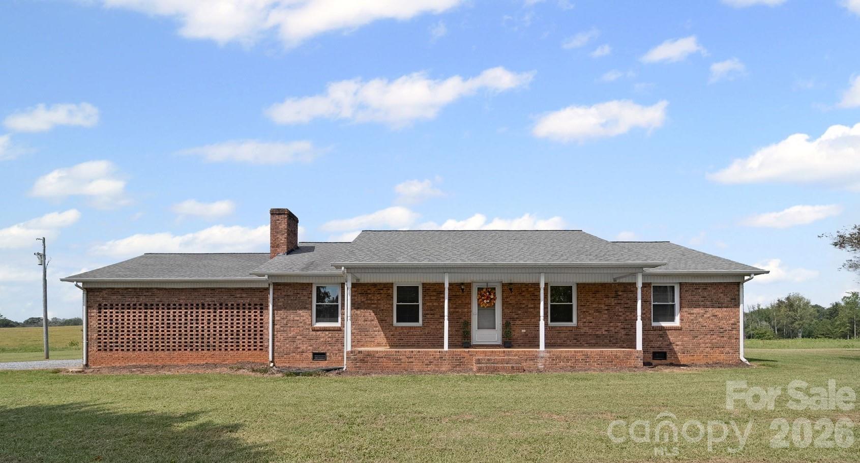 1090 Davids Chapel Church Road Vale, NC 28168 - Photo 1 of 35 a front view of a house with garden