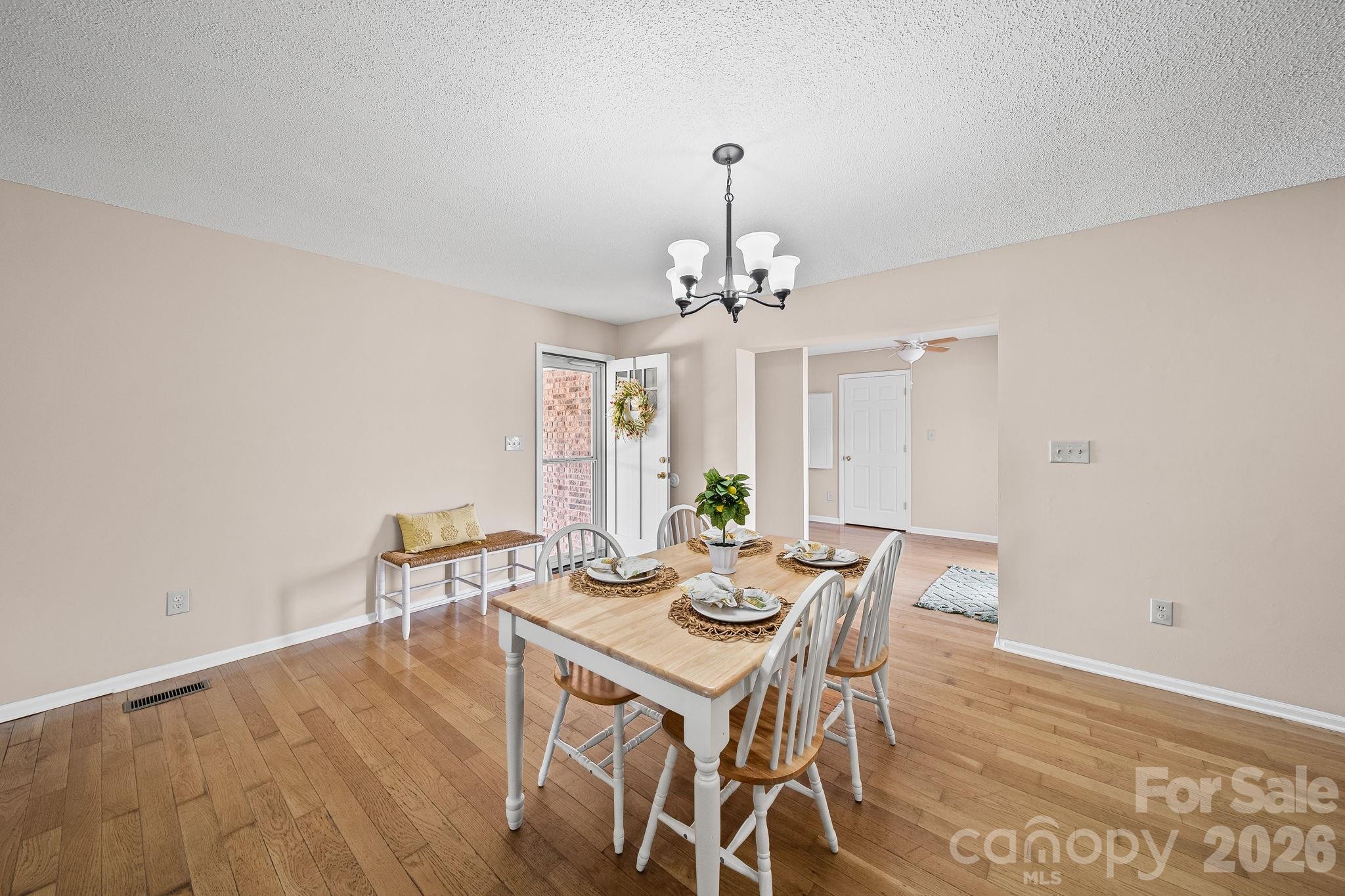 1090 Davids Chapel Church Road Vale, NC 28168 - Photo 13 of 35 a view of a dining room with furniture and wooden floor