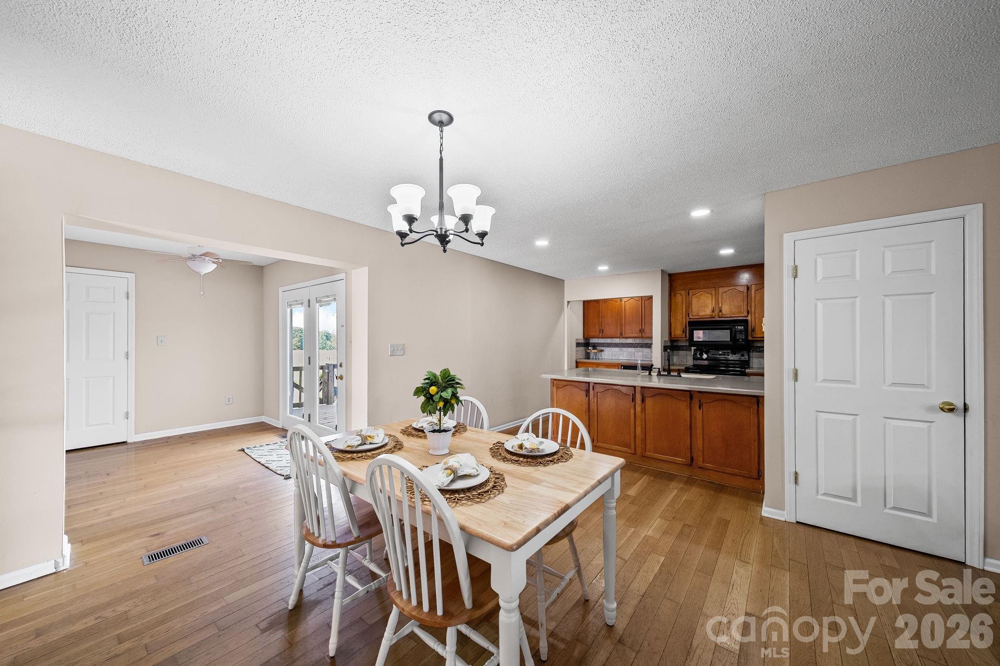 1090 Davids Chapel Church Road Vale, NC 28168 - Photo 14 of 35 a view of a dining room with furniture and wooden floor