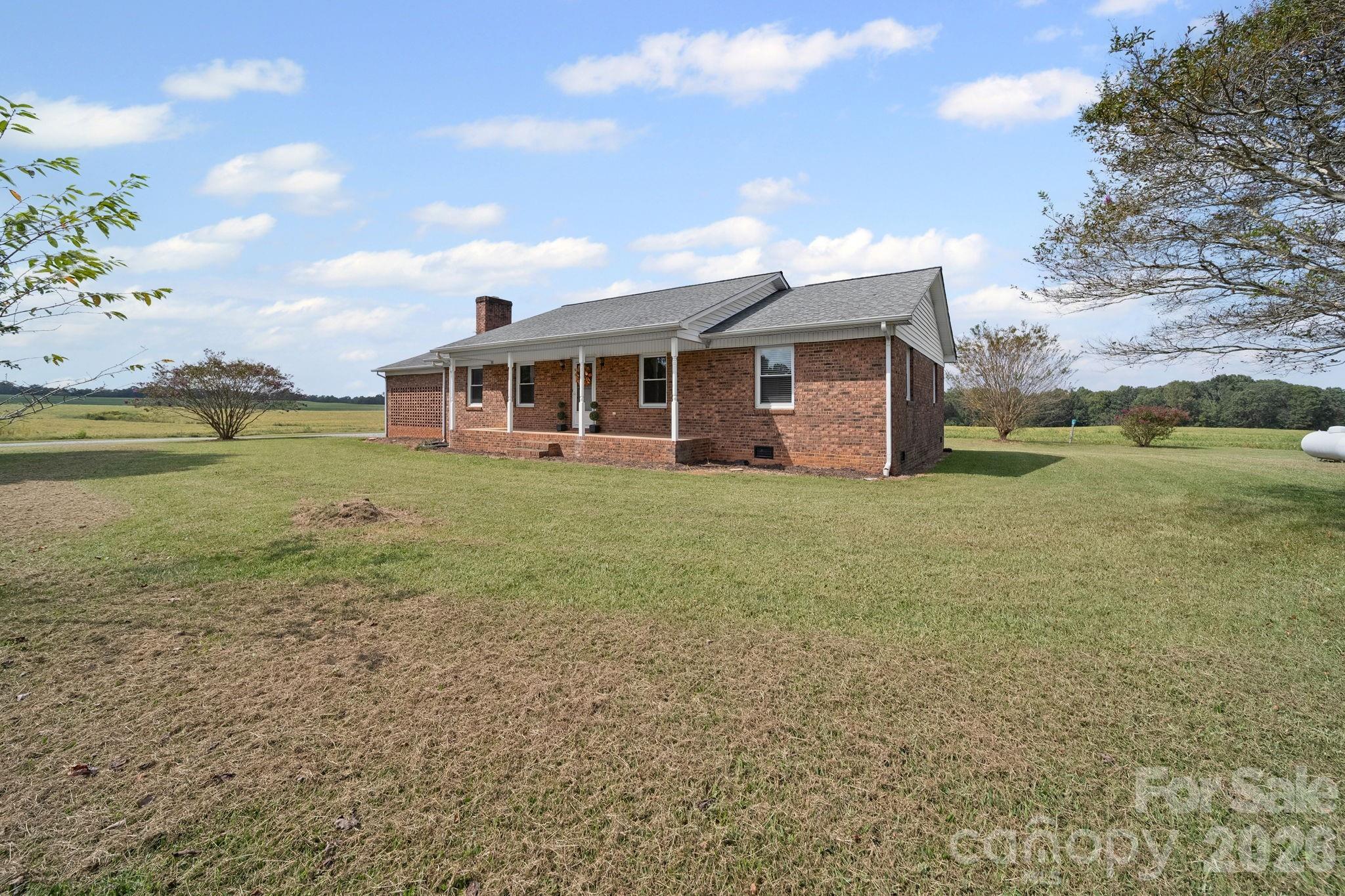 1090 Davids Chapel Church Road Vale, NC 28168 - Photo 2 of 35 a view of a house with a yard and sitting area