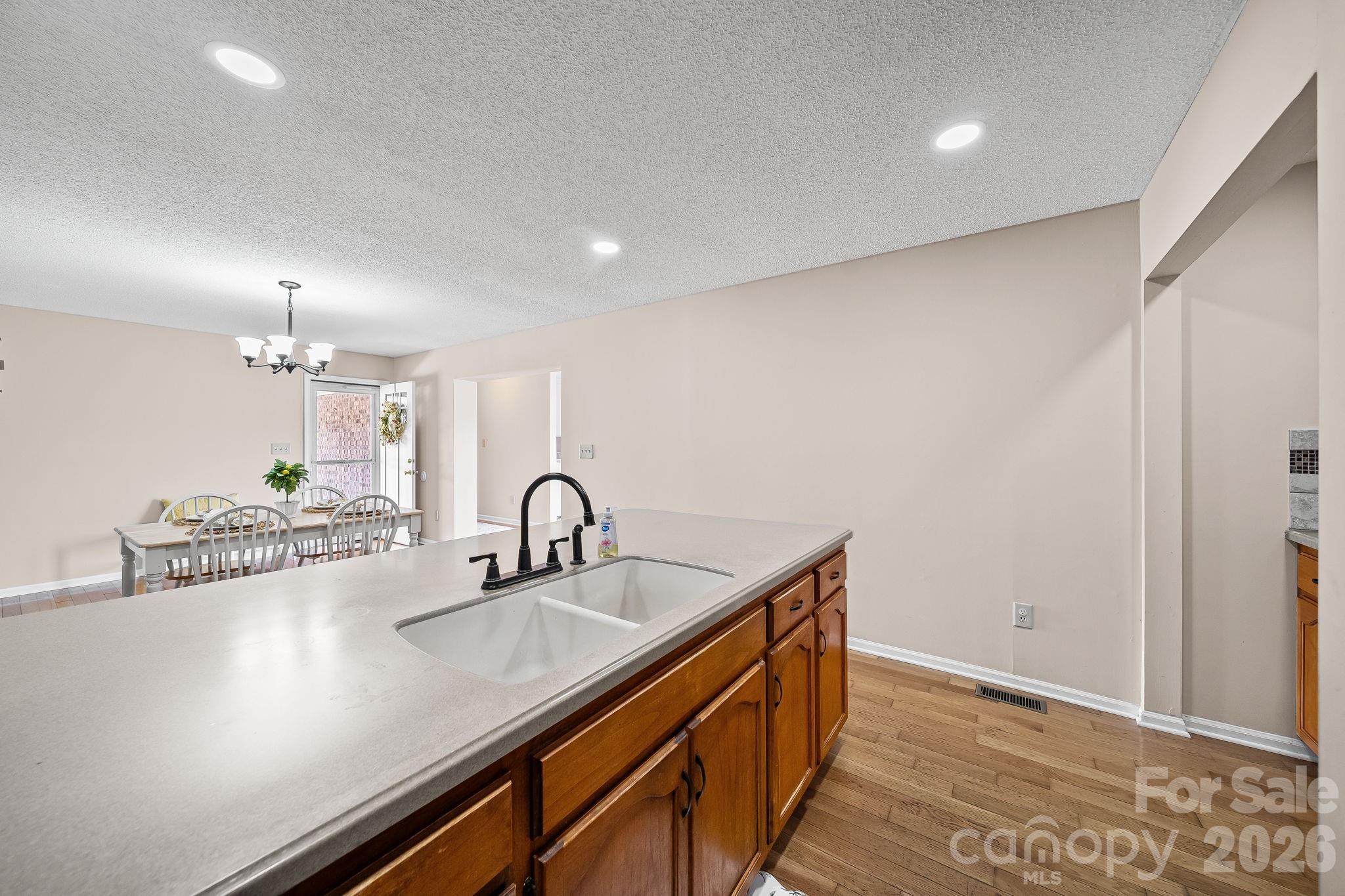 1090 Davids Chapel Church Road Vale, NC 28168 - Photo 21 of 35 a kitchen with a sink and a refrigerator