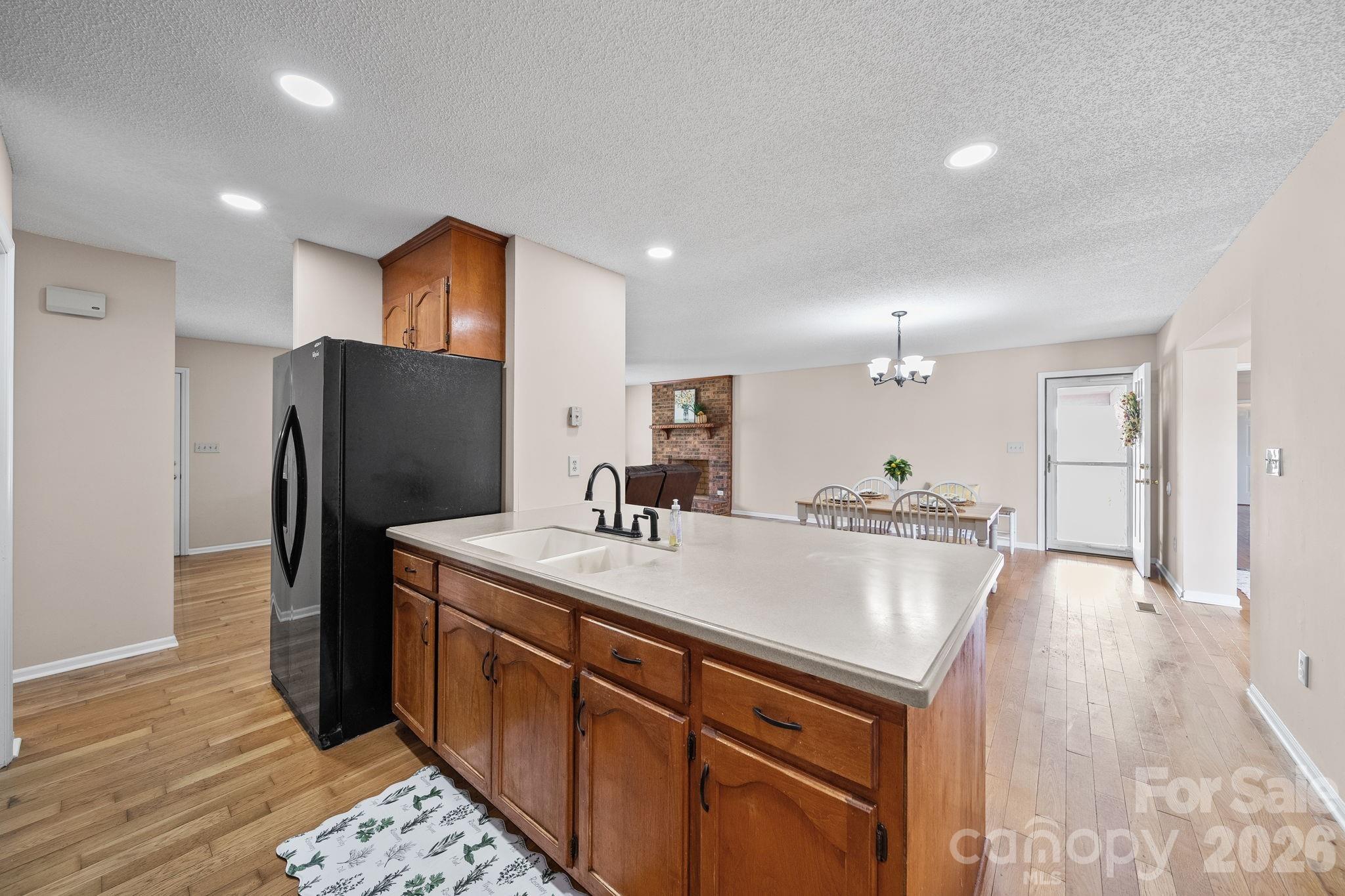 1090 Davids Chapel Church Road Vale, NC 28168 - Photo 23 of 35 a kitchen with kitchen island a sink appliances and a counter top space