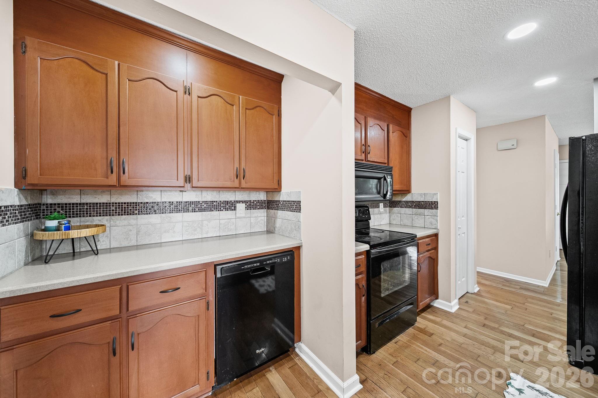 1090 Davids Chapel Church Road Vale, NC 28168 - Photo 24 of 35 a kitchen with stainless steel appliances granite countertop a refrigerator sink and stove