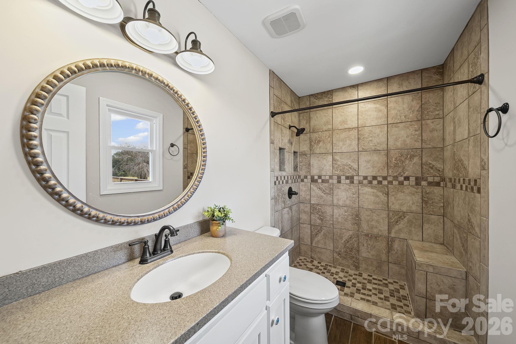 1090 Davids Chapel Church Road Vale, NC 28168 - Photo 31 of 35 a bathroom with a sink a toilet and a mirror