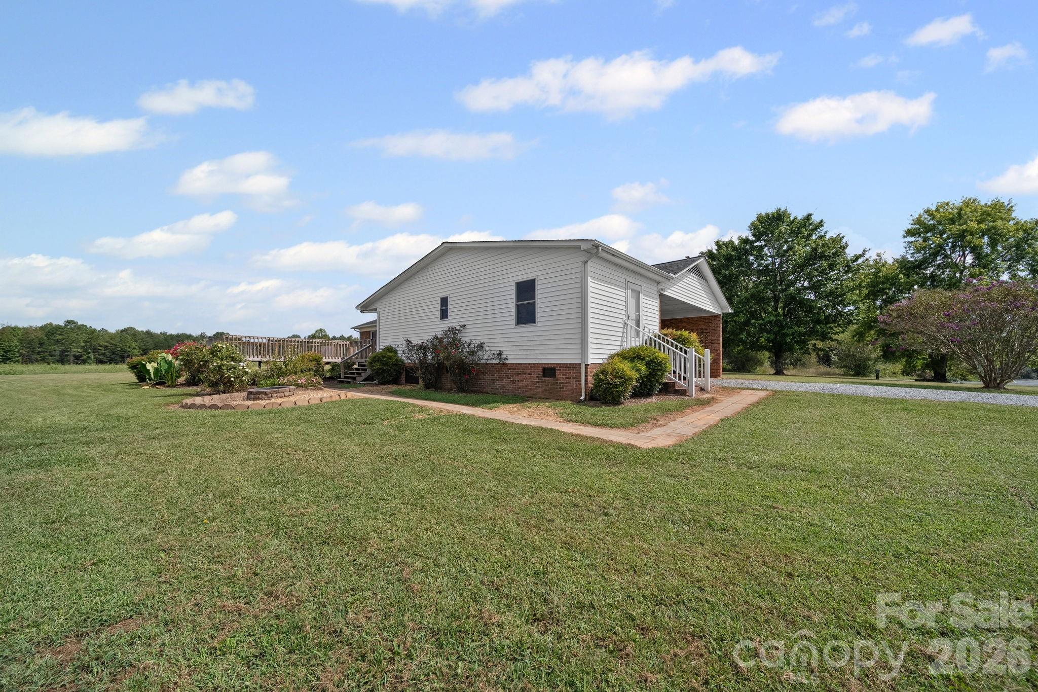 1090 Davids Chapel Church Road Vale, NC 28168 - Photo 6 of 35 a view of a house with a backyard