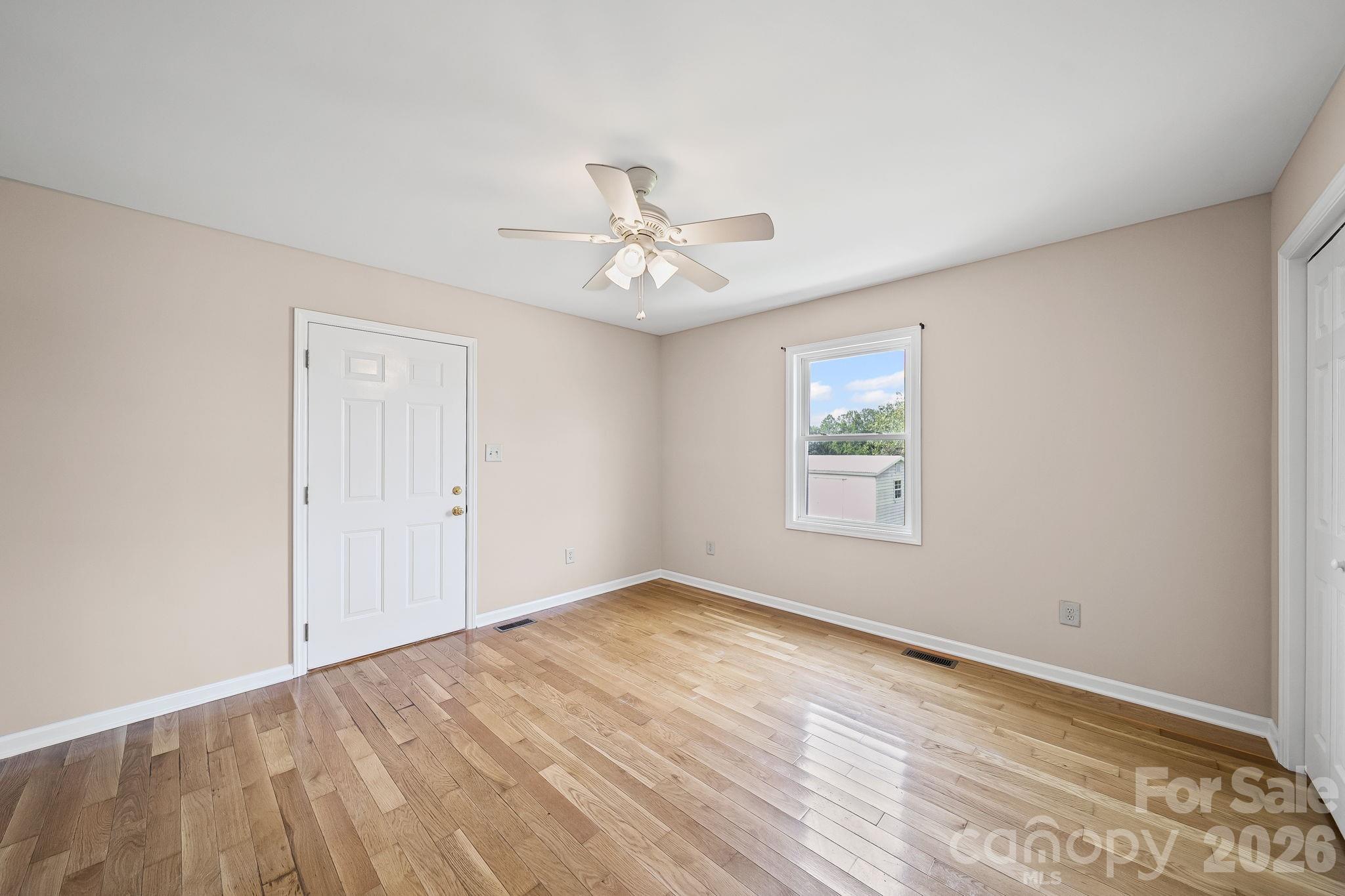 1090 Davids Chapel Church Road Vale, NC 28168 - Photo 9 of 35 wooden floor in an empty room with a window