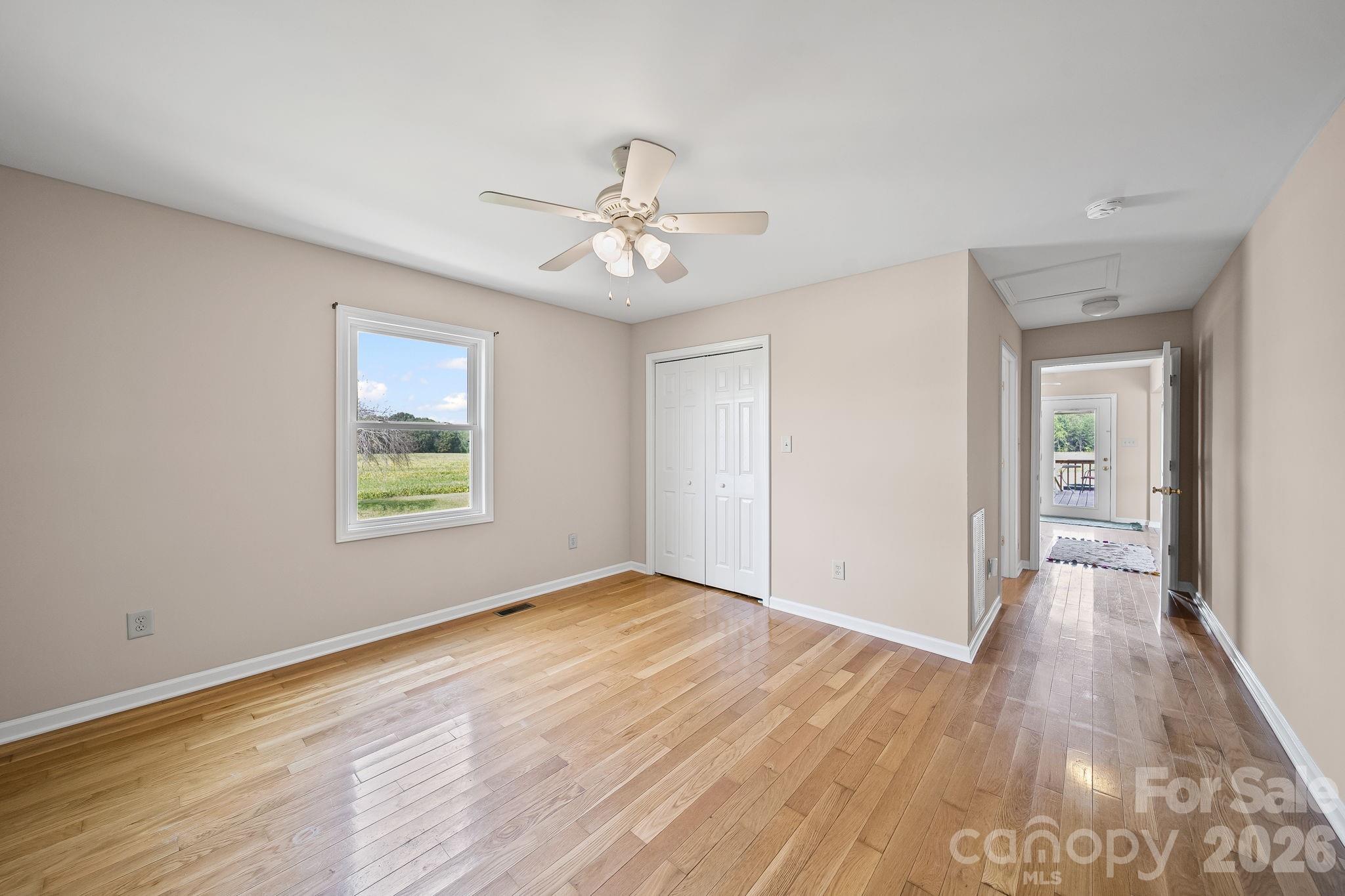 1090 Davids Chapel Church Road Vale, NC 28168 - Photo 10 of 35 wooden floor in an empty room with a window