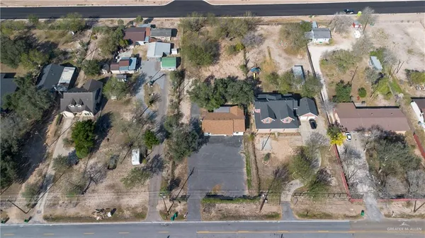 a view of a house with a tree