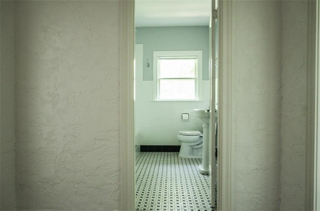2301 Enfield Road Austin, TX 78703 - Photo 11 of 27 Bathroom with a textured wall and tile patterned floors
