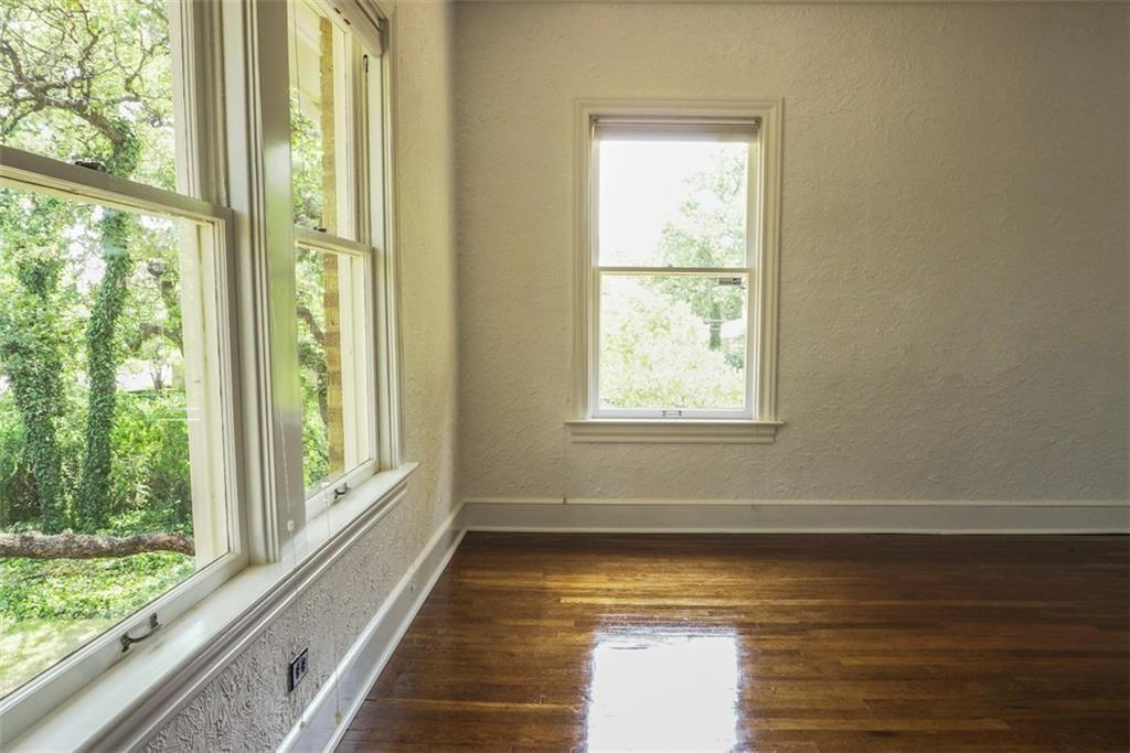 2301 Enfield Road Austin, TX 78703 - Photo 16 of 27 Unfurnished room featuring a textured wall and dark wood-style floors