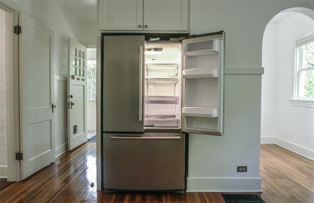 2301 Enfield Road Austin, TX 78703 - Photo 7 of 27 Kitchen featuring freestanding refrigerator and dark wood-style floors