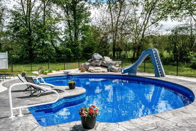 a view of a swimming pool with a patio